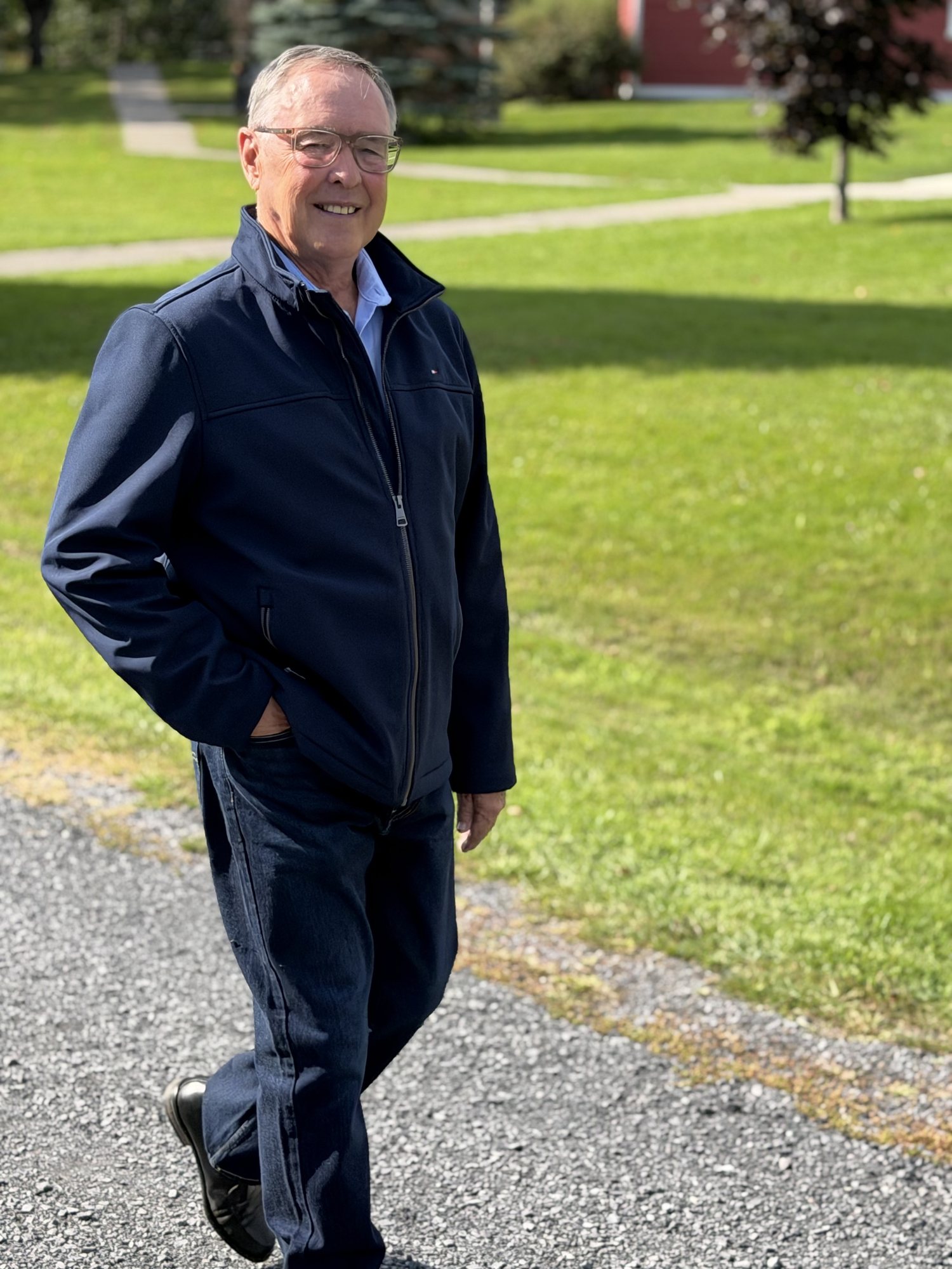 Keith MacCuaig seated comfortably in a burgundy sweater