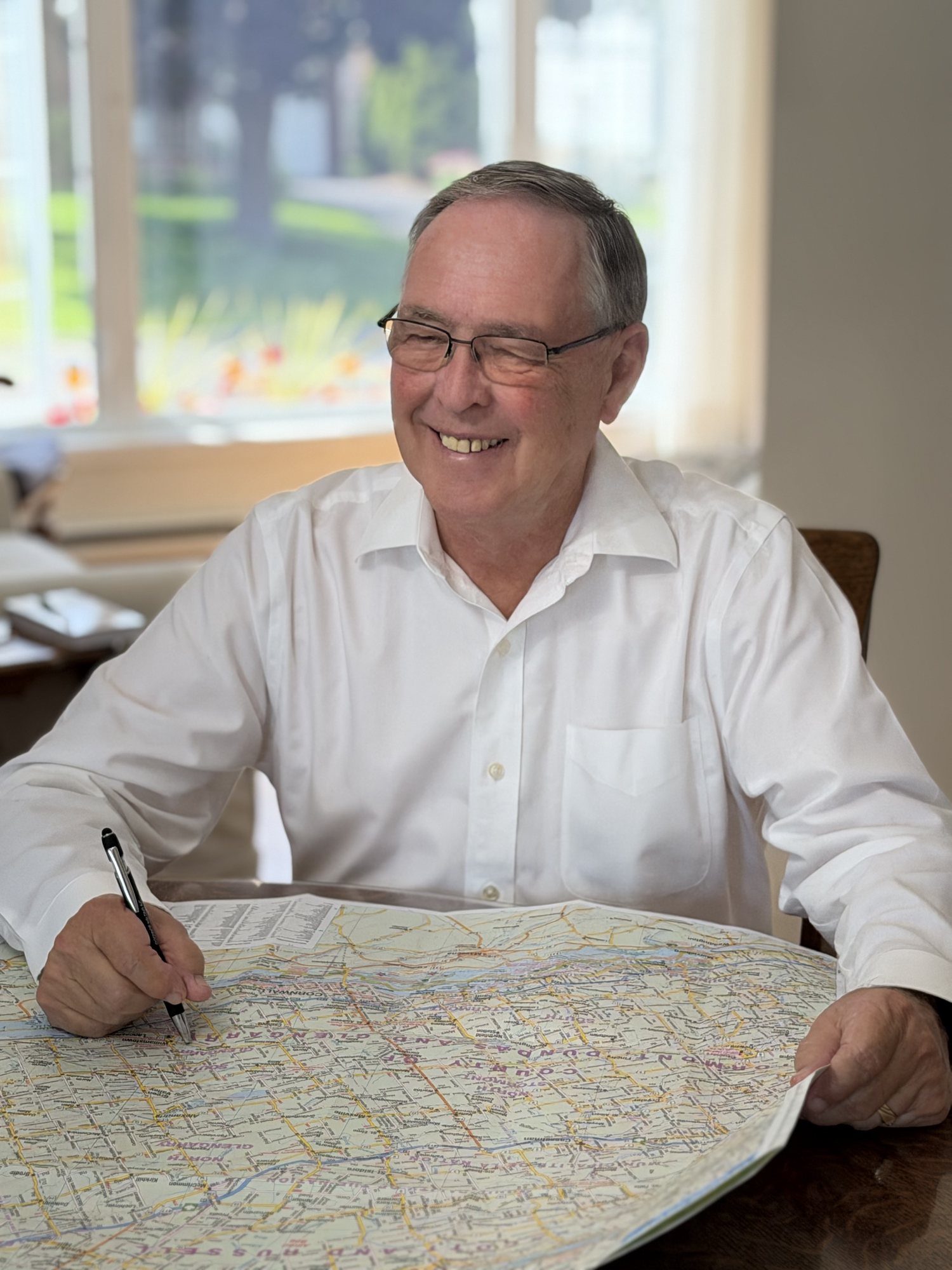 Keith MacCuaig reviewing a map at a table