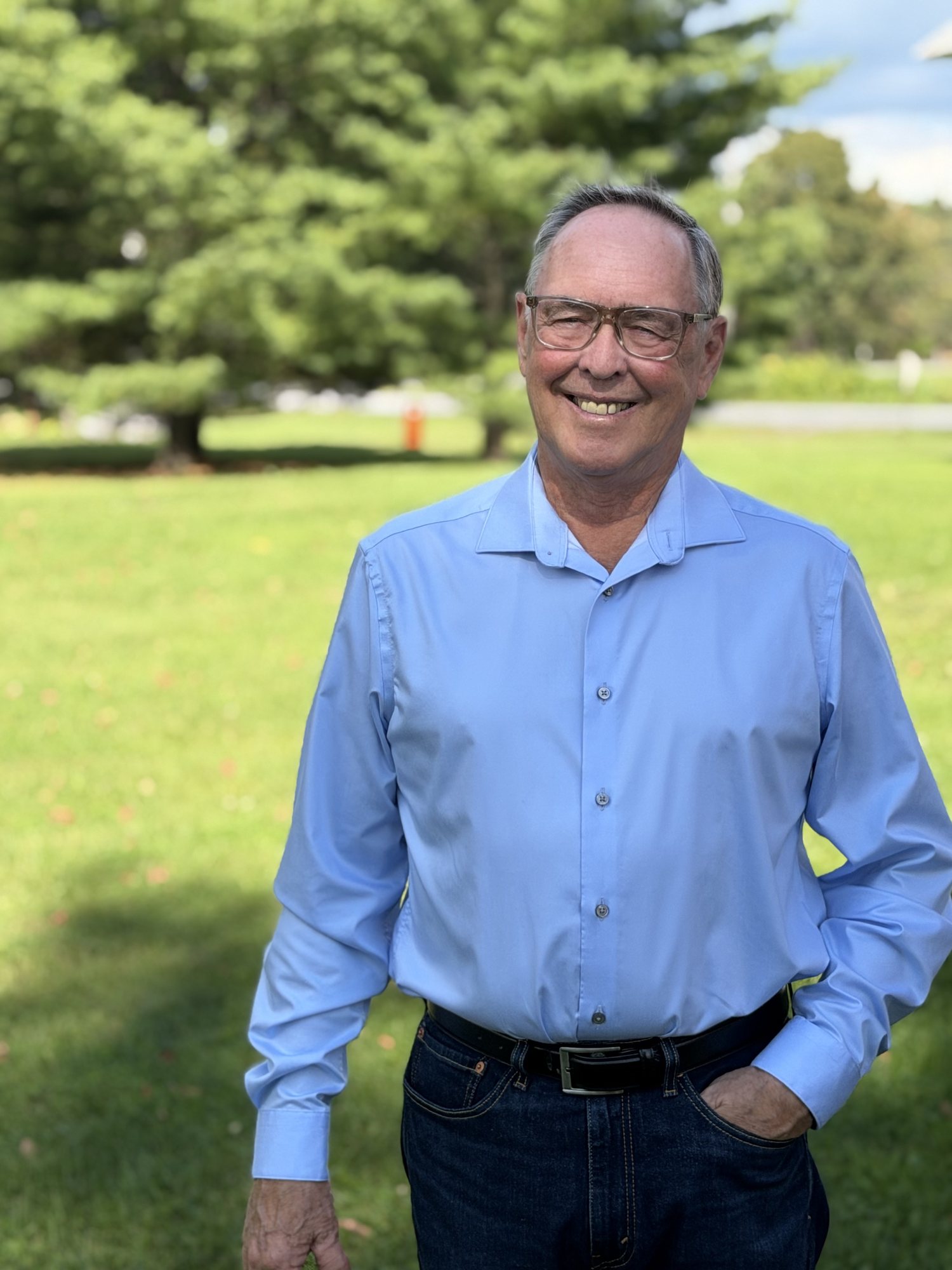Keith MacCuaig standing outdoors in a light blue shirt
